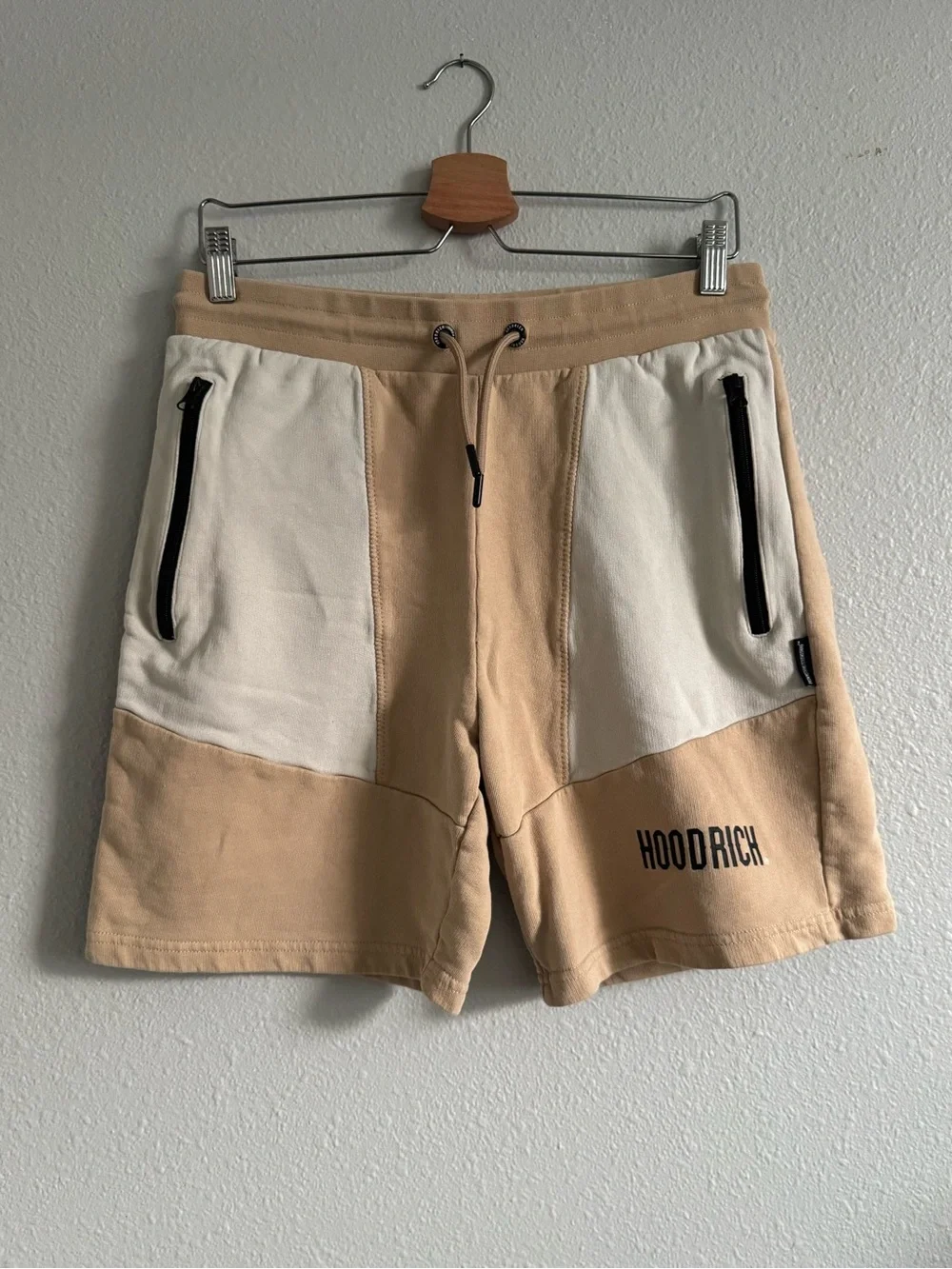 M Hoodrich Tan/Beige Color Block Shorts, drawstring waist & zippered pockets.